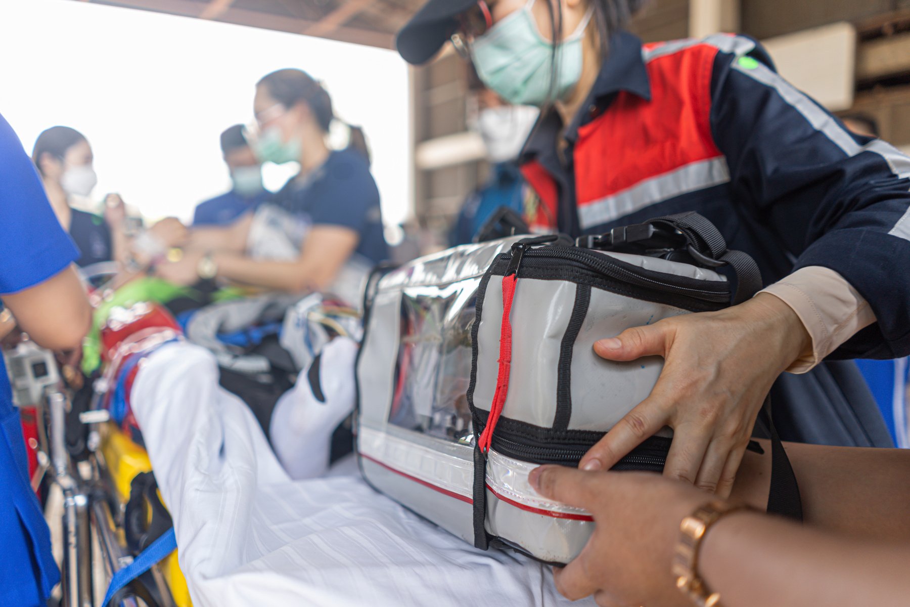 Nursing Aide Holding a First Aid Kit for Emergency Operation